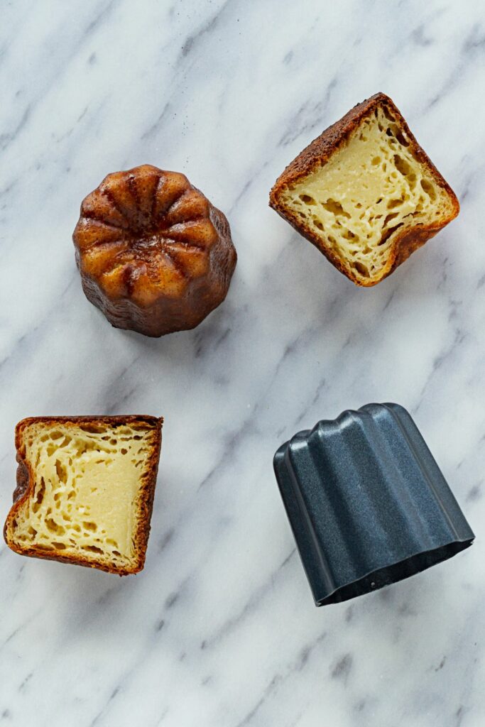 A canelé from the inside and outside with its mould